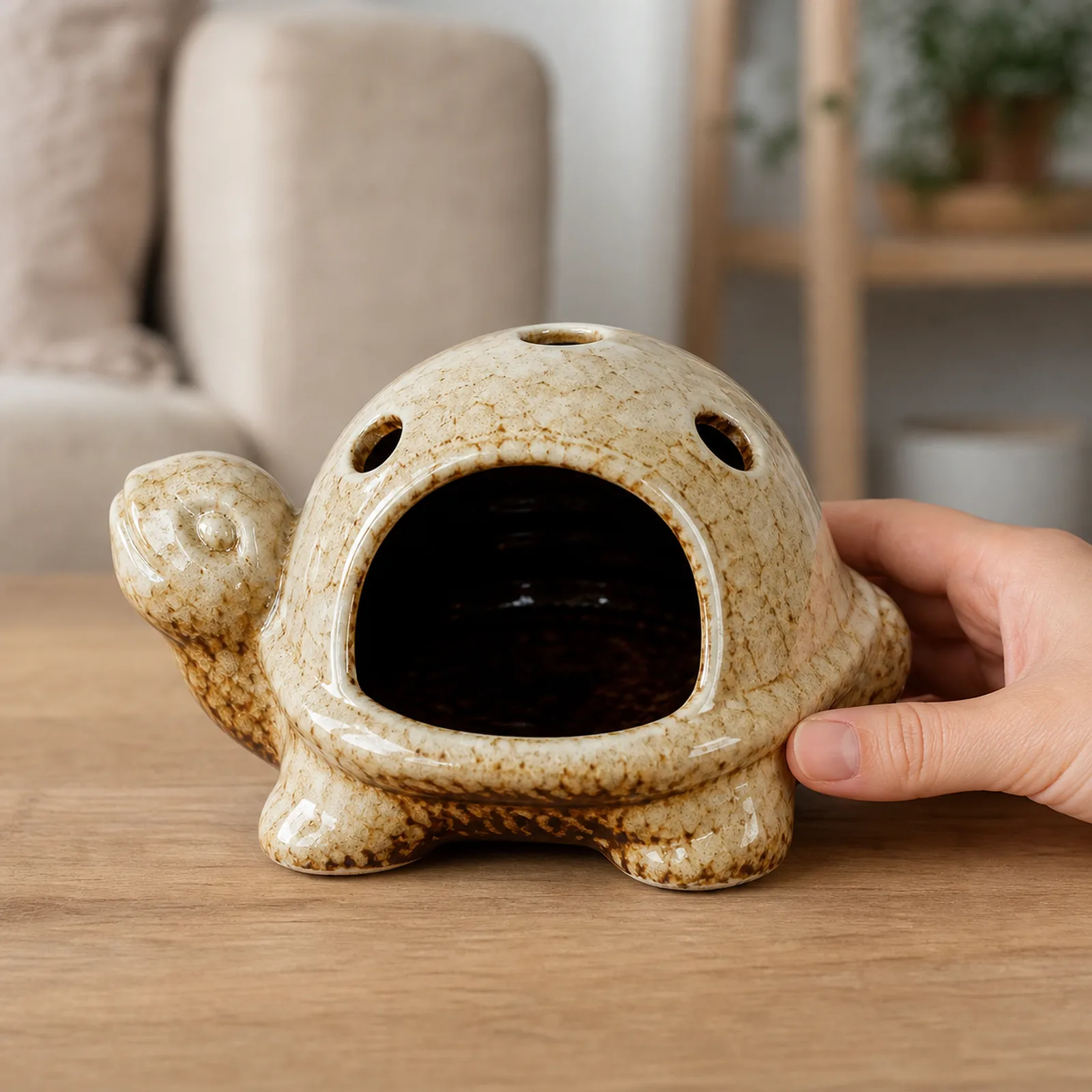 Brown kiln-effect ceramic turtle Palo Santo holder hand scale view