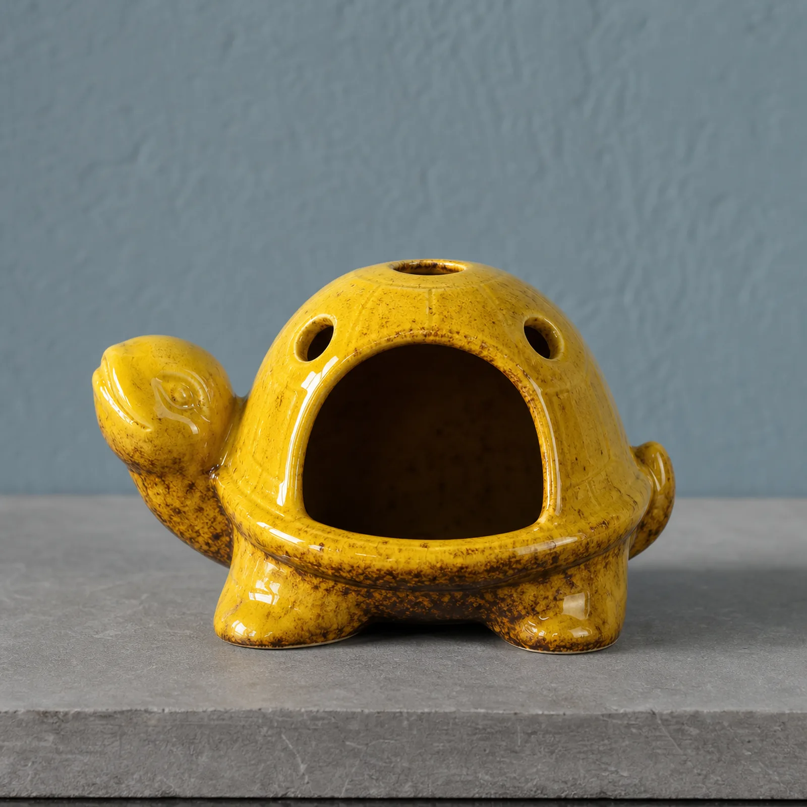 Yellow kiln-effect ceramic turtle Palo Santo holder clean front view