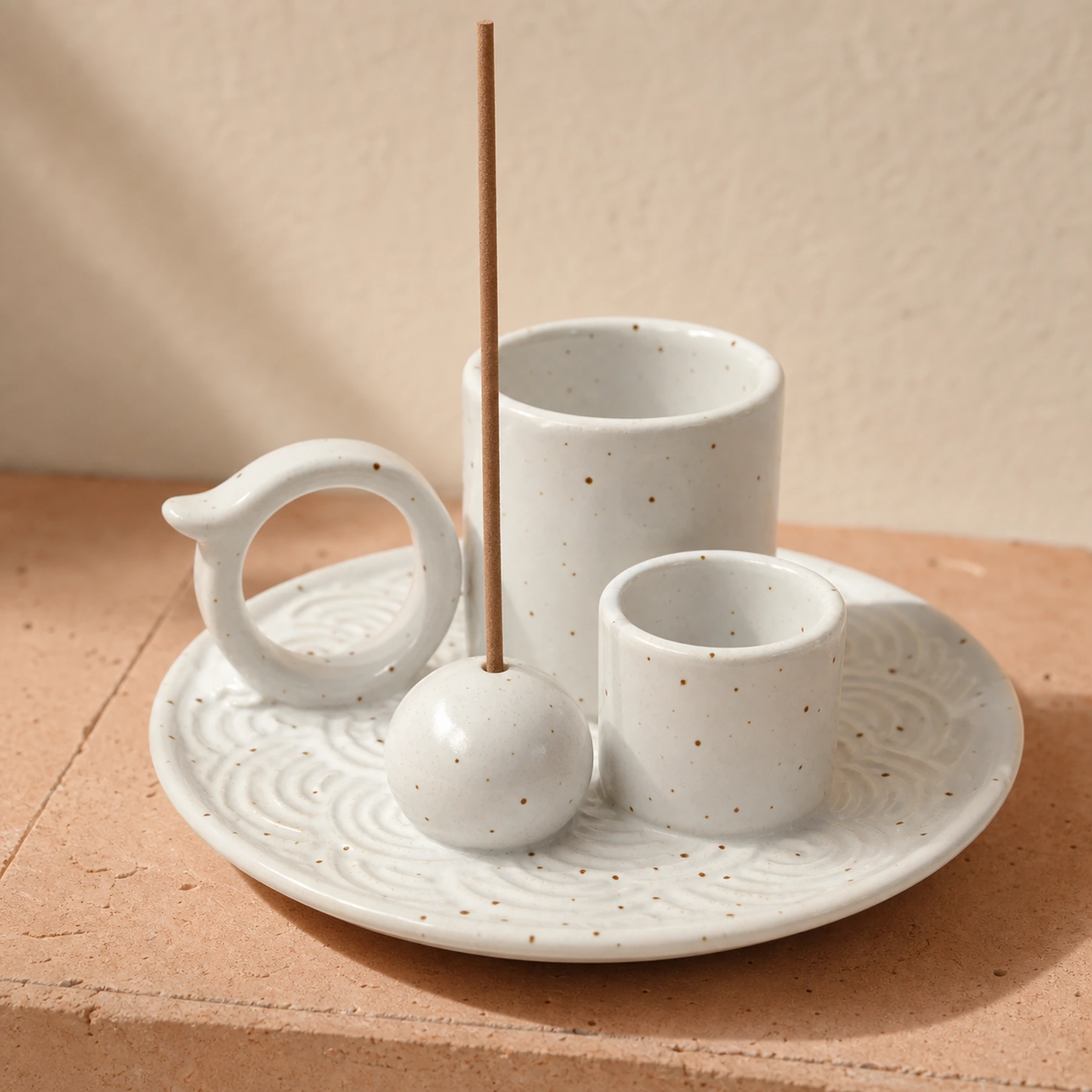 White glaze 5-in-1 ceramic smudge bowl close-up showing embossed tray, glaze, cups, ring, and incense-stick seat