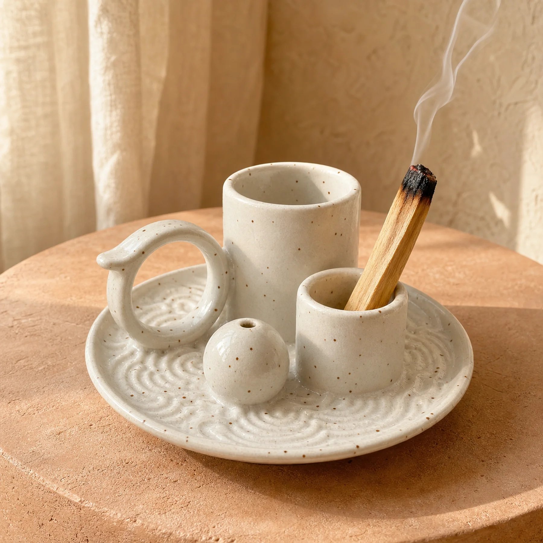 White glaze 5-in-1 ceramic smudge bowl with visible-tip smoldering Palo Santo and a thin smoke curl