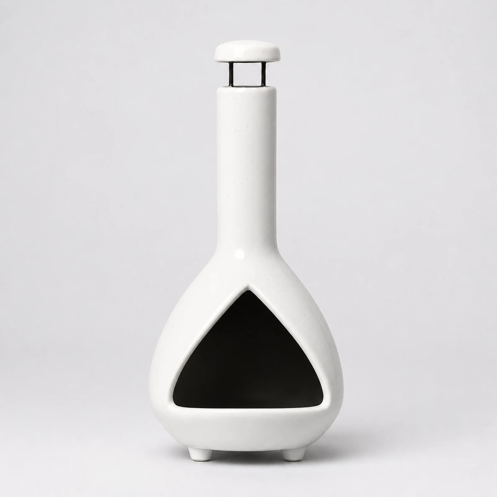 White ceramic Palo Santo holder shown empty from the front on a warm neutral surface