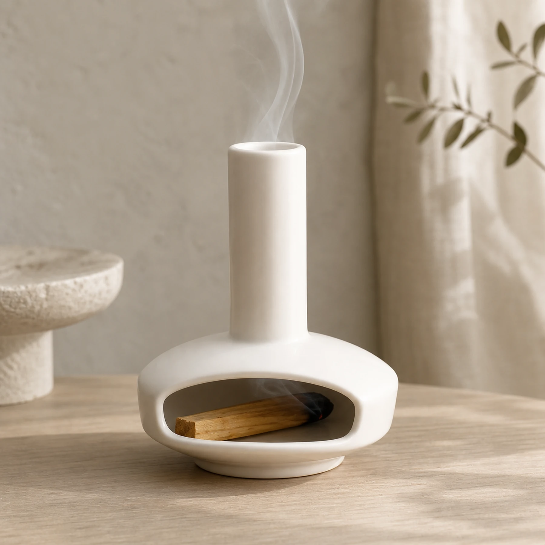 White mini ceramic Palo Santo burner with short wood and chimney smoke