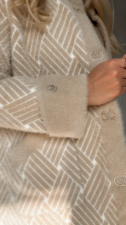 An elegant alpaca wool coat adorned with a woven pattern.