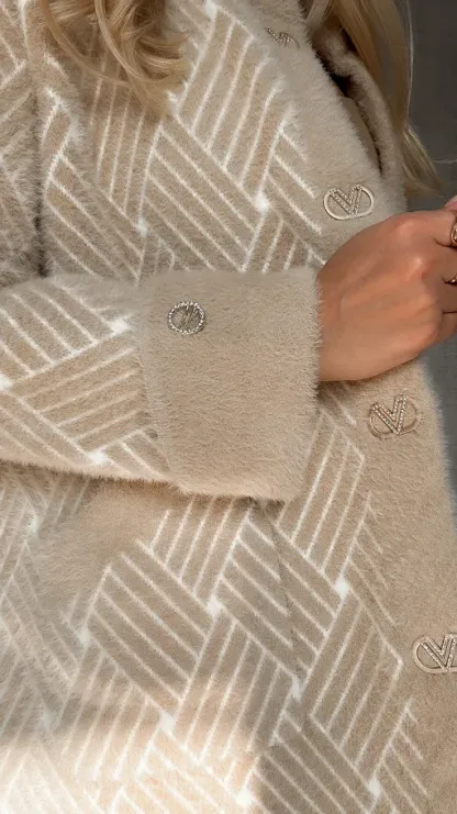 An elegant alpaca wool coat adorned with a woven pattern.