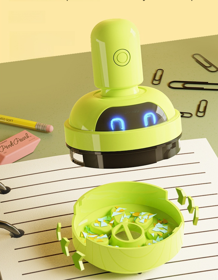 Kabelloser Cartoon-Mini-Tischstaubsauger auf Schreibtisch