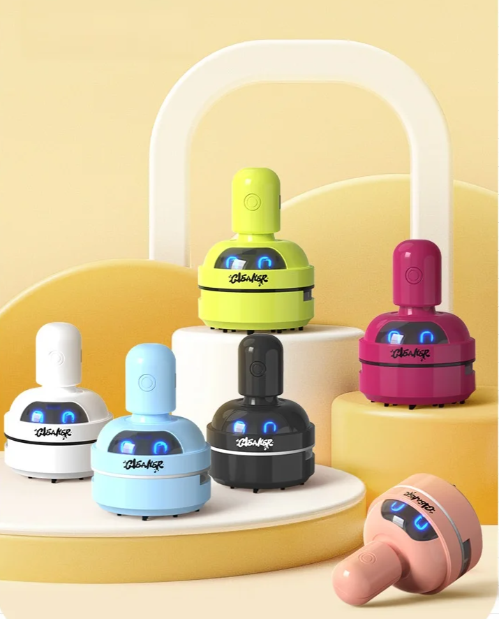 Mini Tischstaubsauger mit Cartoon-Design in Aktion