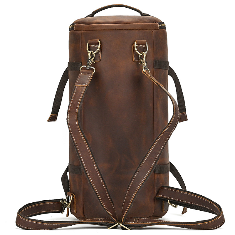 Brown leather duffle backpack with exterior zipper pocket
