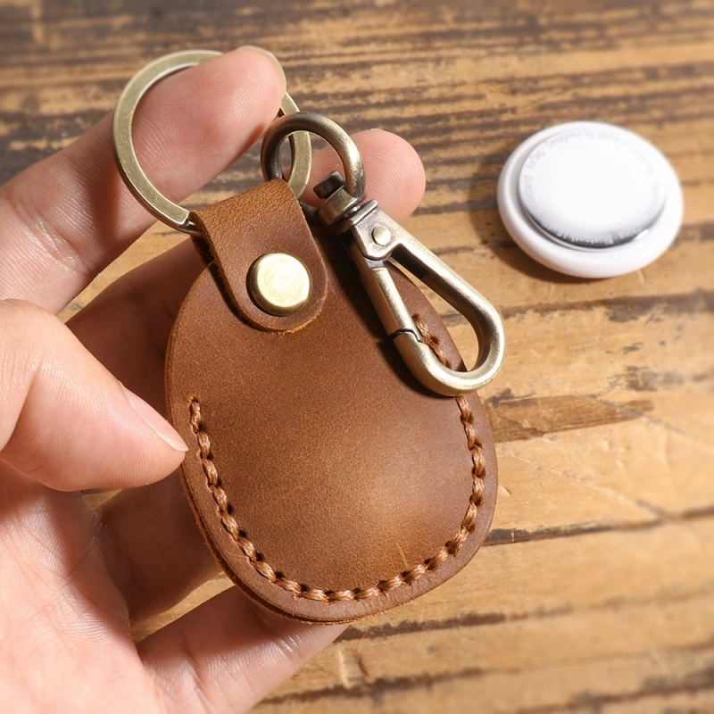 Leather AirTag holder with snap button closure and stitched edge