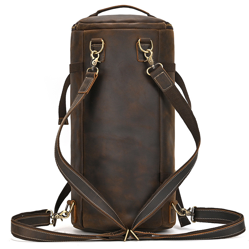 Leather barrel duffle bag with brass tone hardware
