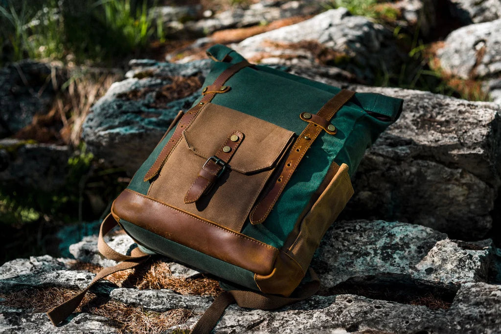 roll top backpack with padding. ultralight webbing. and side pockets to store a umbrella or water-bottle