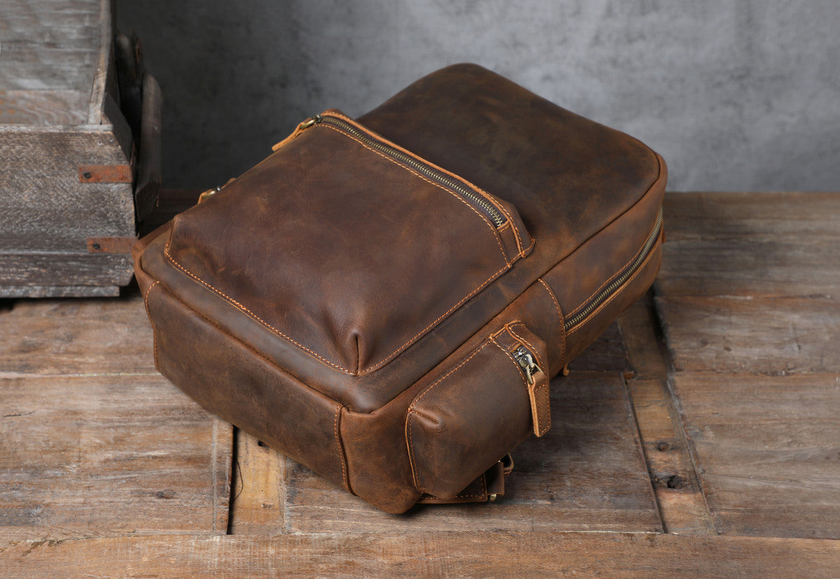 handmade beautiful distressed leather backpack with with quilted laptop sleeve to carry your macbook and ipad tablet