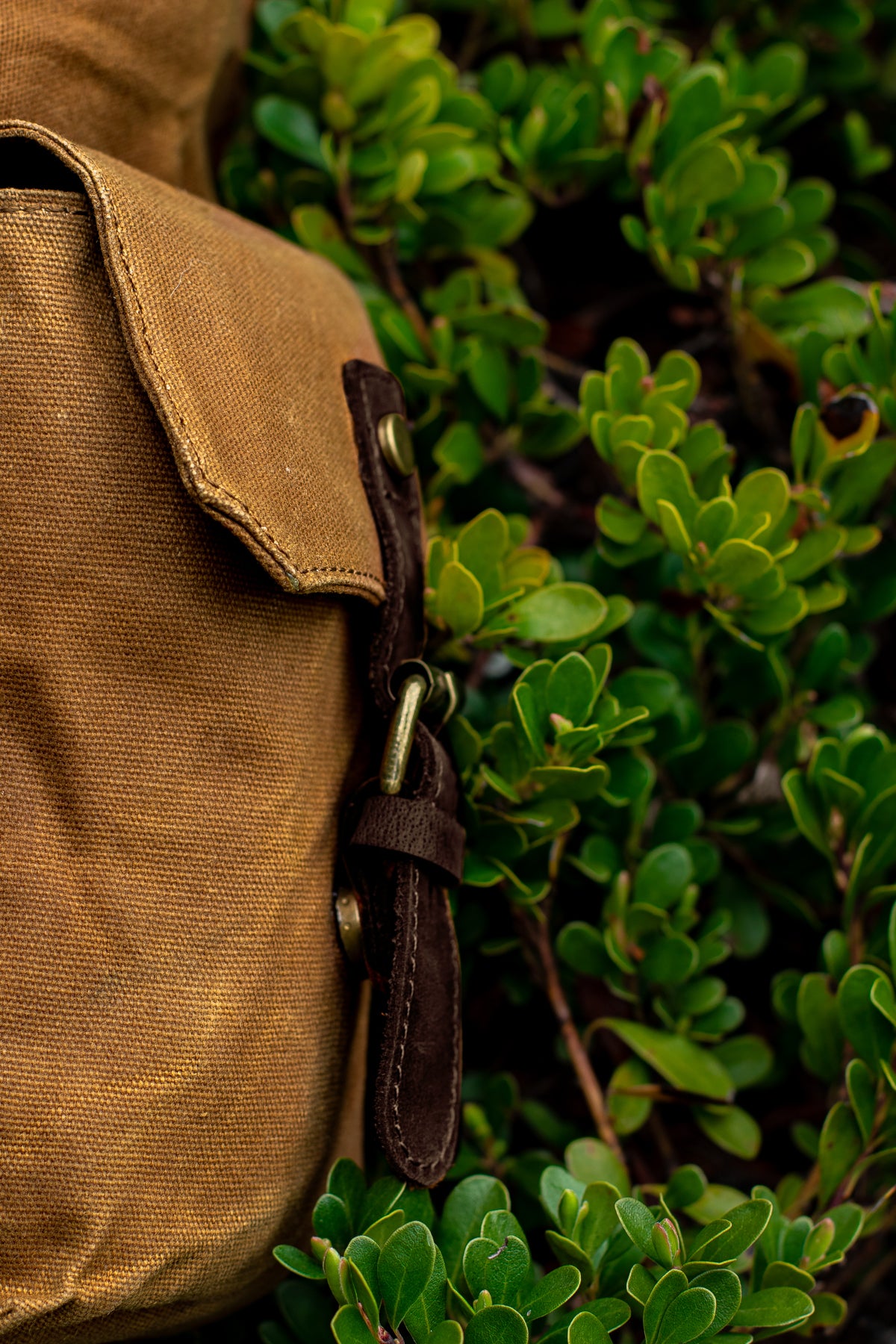 large and roomy exterior side flap pockets of the water repellent waxed canvas travel hiking bag