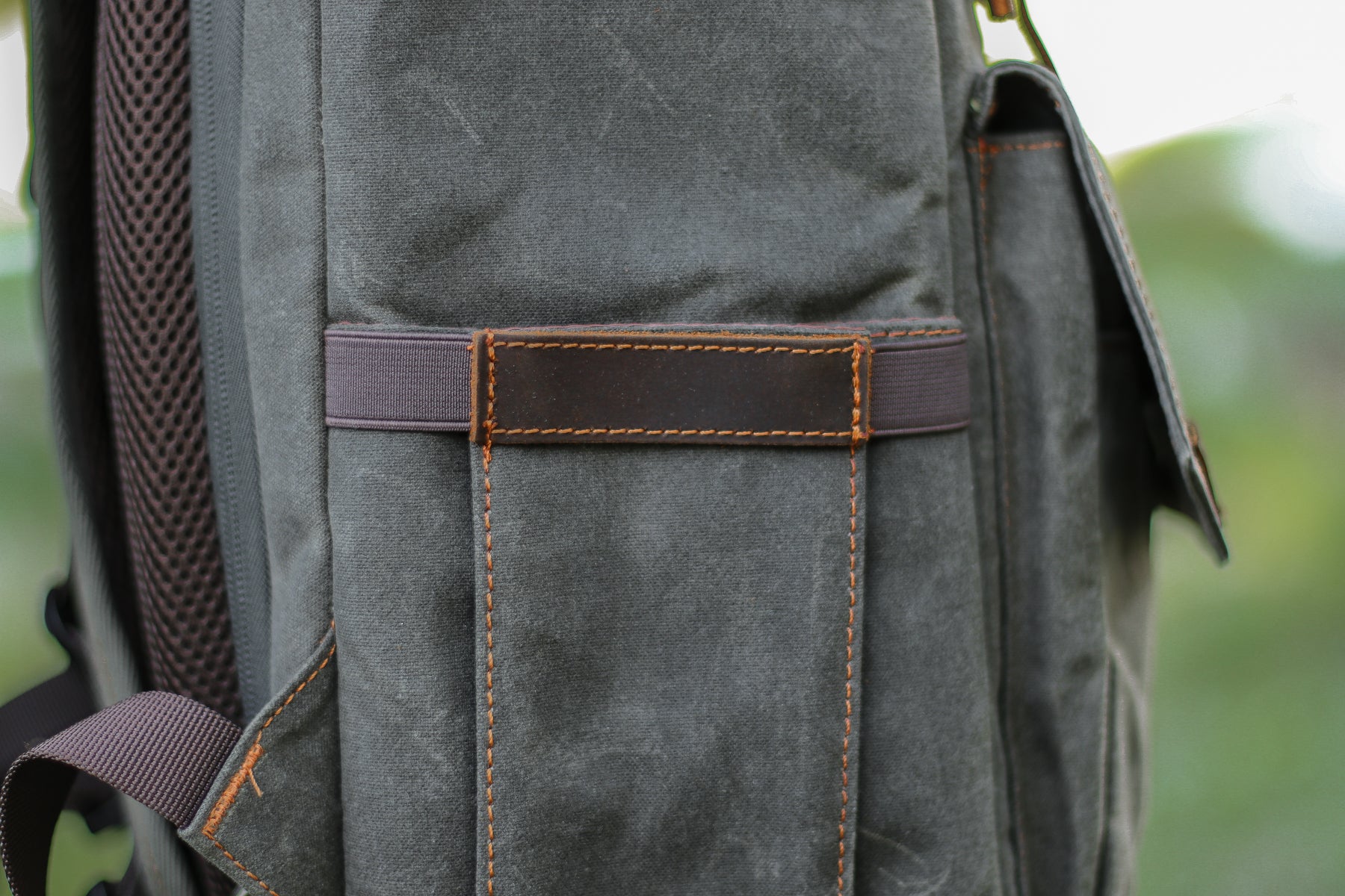 camera backpack side pocket to store a monopod. camera straps or accessories such as memory cards or chargers