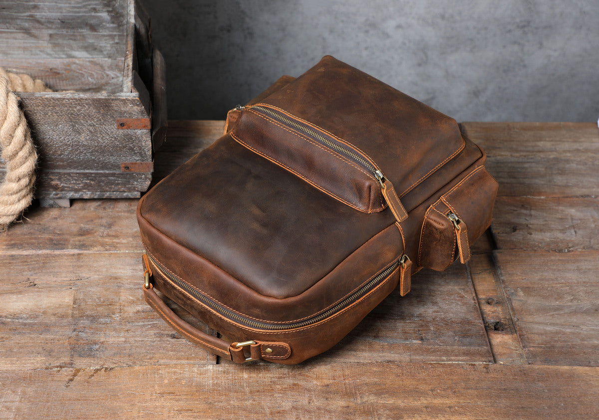 real leather carry-all backpack womens with gold-tone brass hardware and metallic buckle