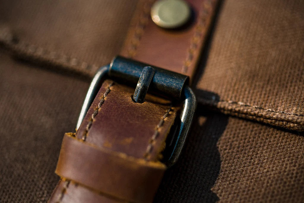 rolltop laptop backpack with a quilted laptop sleeve or tablet sleeve with a velcro strap