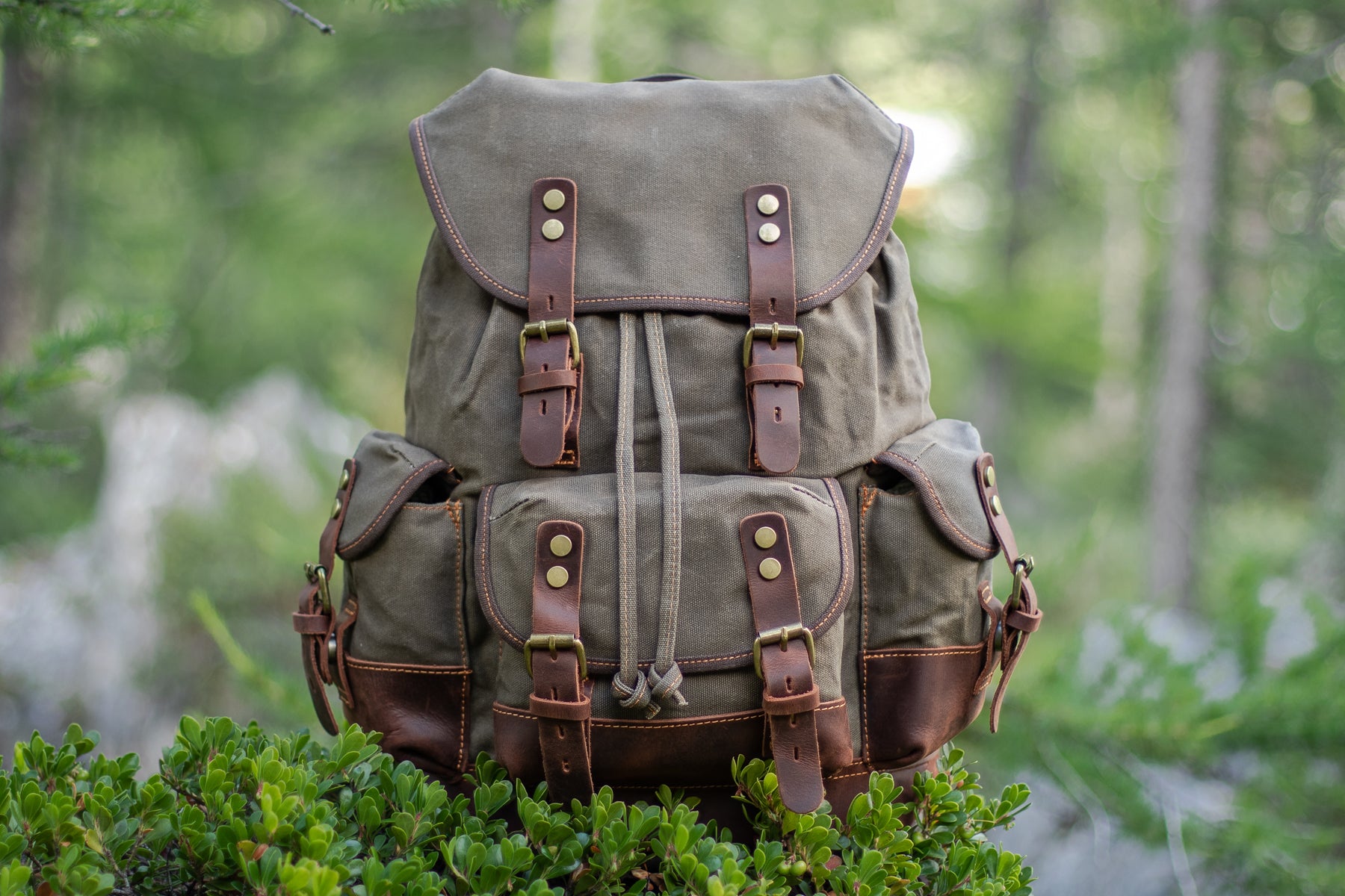 waxed canvas hiking backpack used for travel and weekend trips
