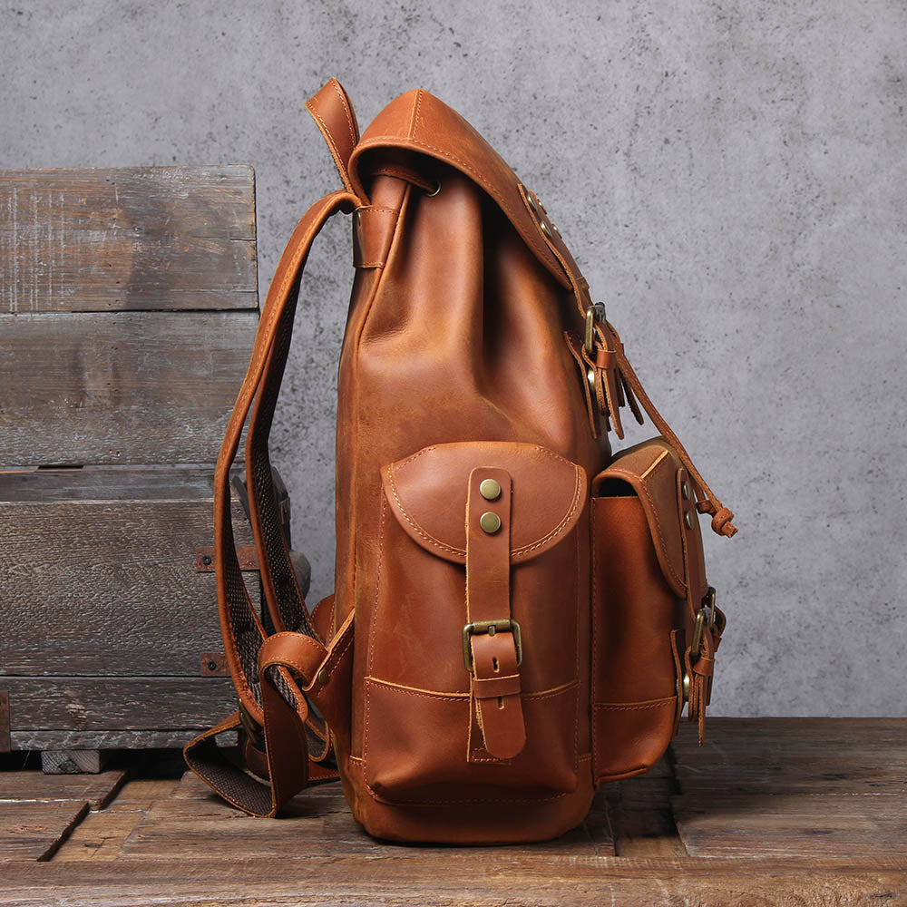 handcrafted camel all leather laptop backpack with adjustable strap and quilted laptop sleeve to store a macbook or ipad tablet