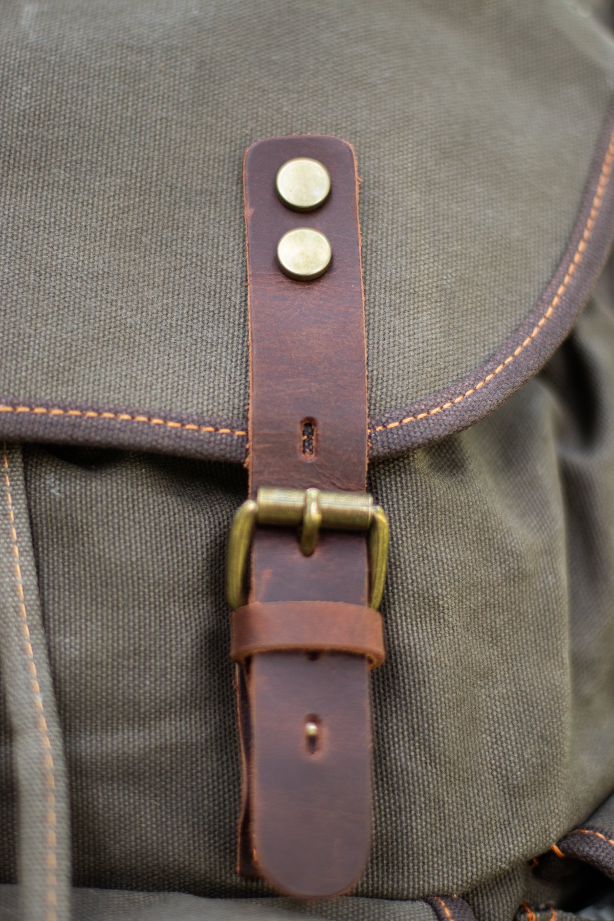 canvas hiking backpack worn outdoors in a casual everyday setting