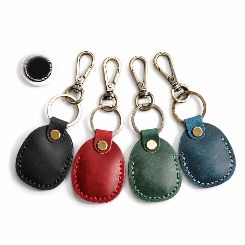 Leather AirTag holder keychain in brown with metal clip and key ring