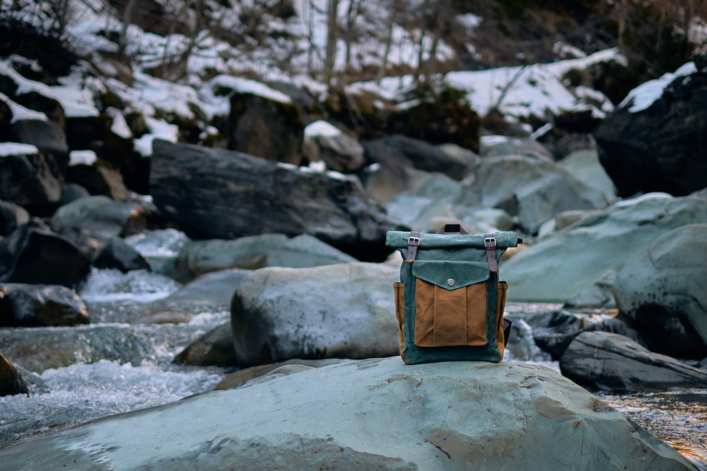 leather roll top backpack with adjustable straps