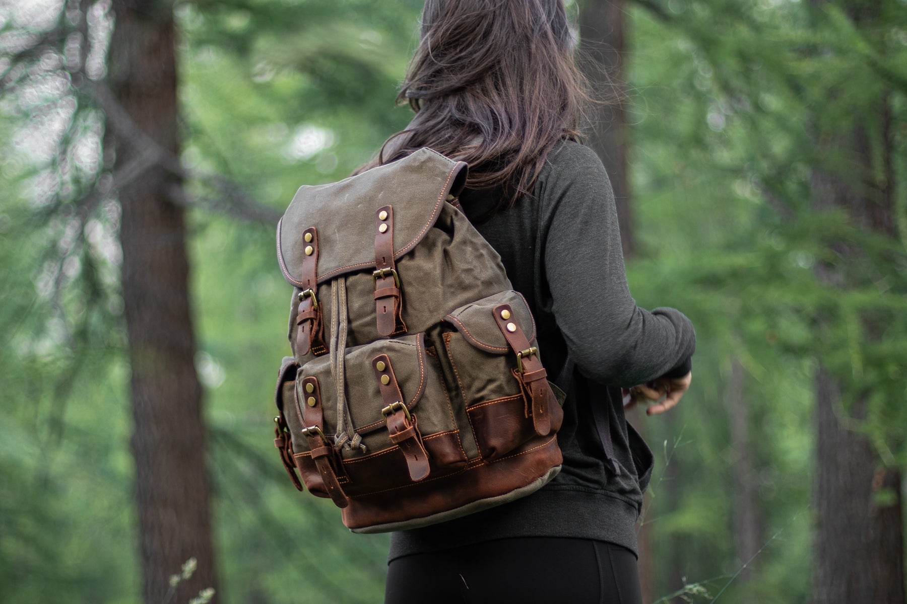 canvas hiking backpack packed with travel and outdoor essentials