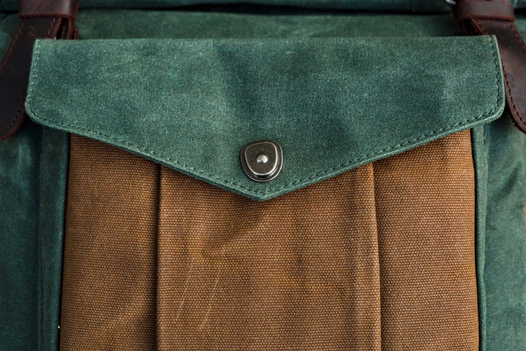 travel roll top laptop backpack with zipped pockets. perfect for backpacking