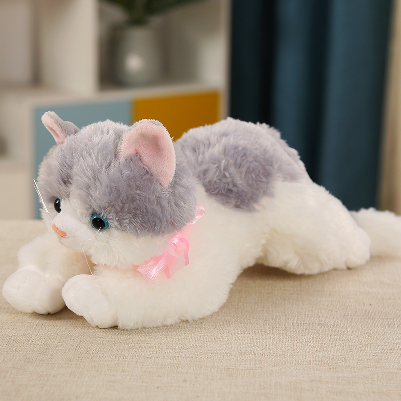 This is a lifelike plush cat toy that can meow. It's a cute cat doll in a lying position, perfect as a birthday gift for children or as a companion for sleep.