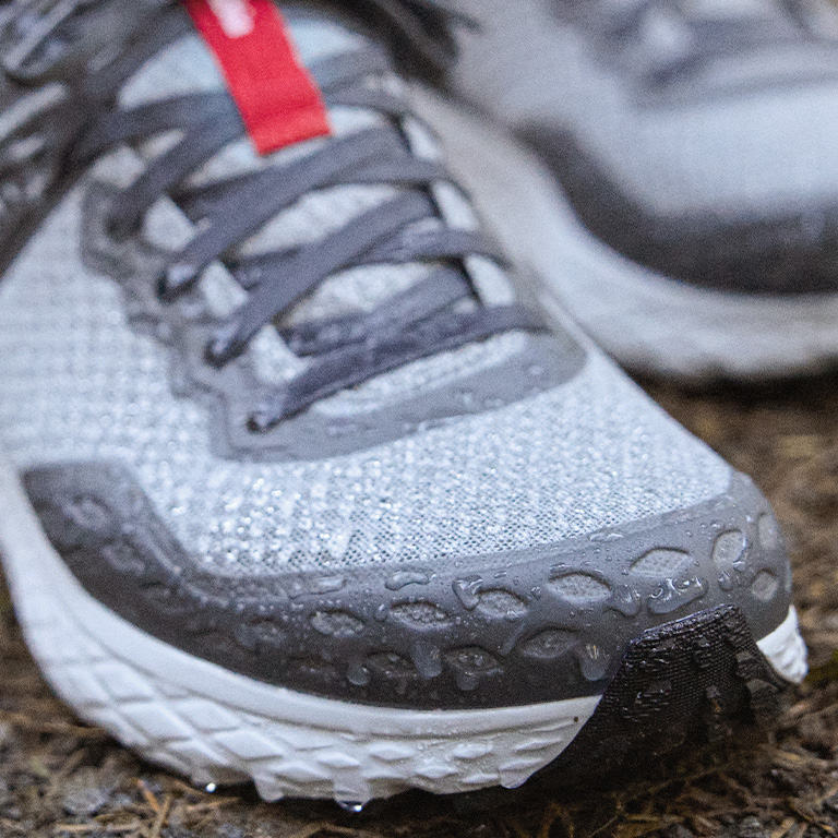 Close-up of the Konos sneakers' waterproof construction in action