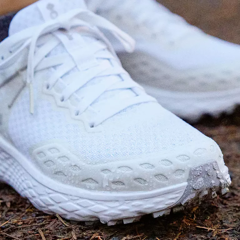 Close-up of the Konos sneakers waterproof construction in action