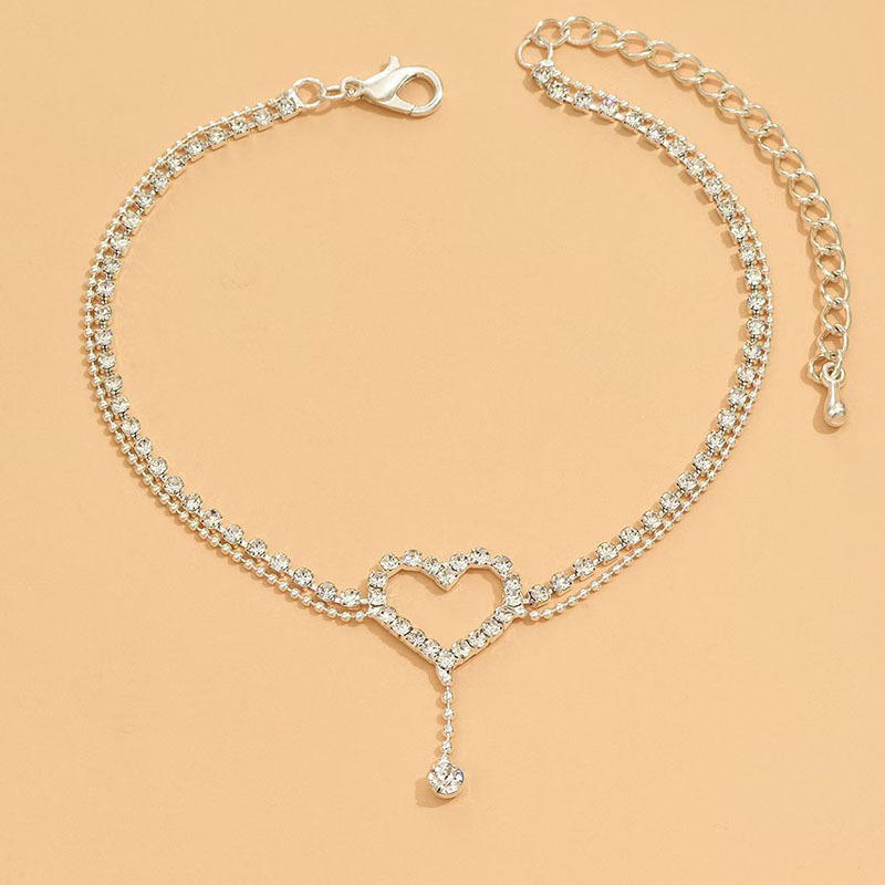 Diamond-encrusted heart-shaped anklet