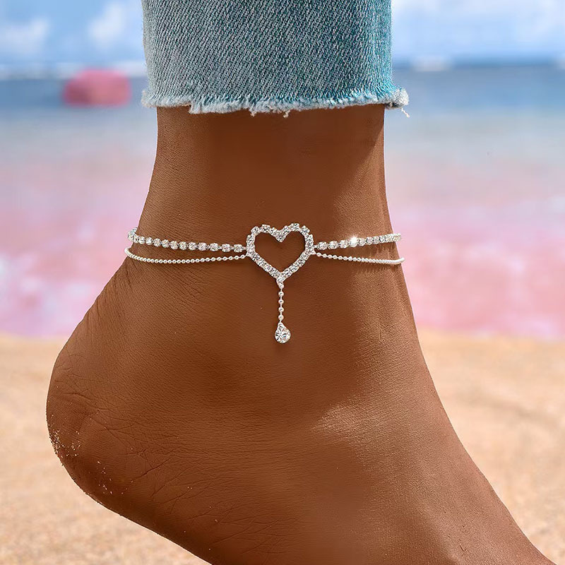 Diamond-encrusted heart-shaped anklet