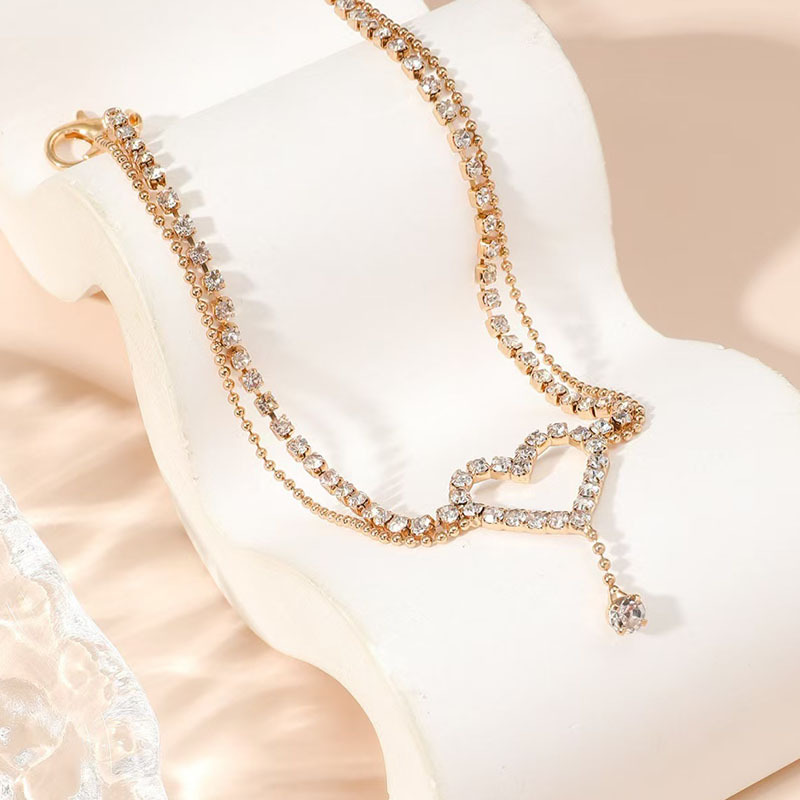Diamond-encrusted heart-shaped anklet
