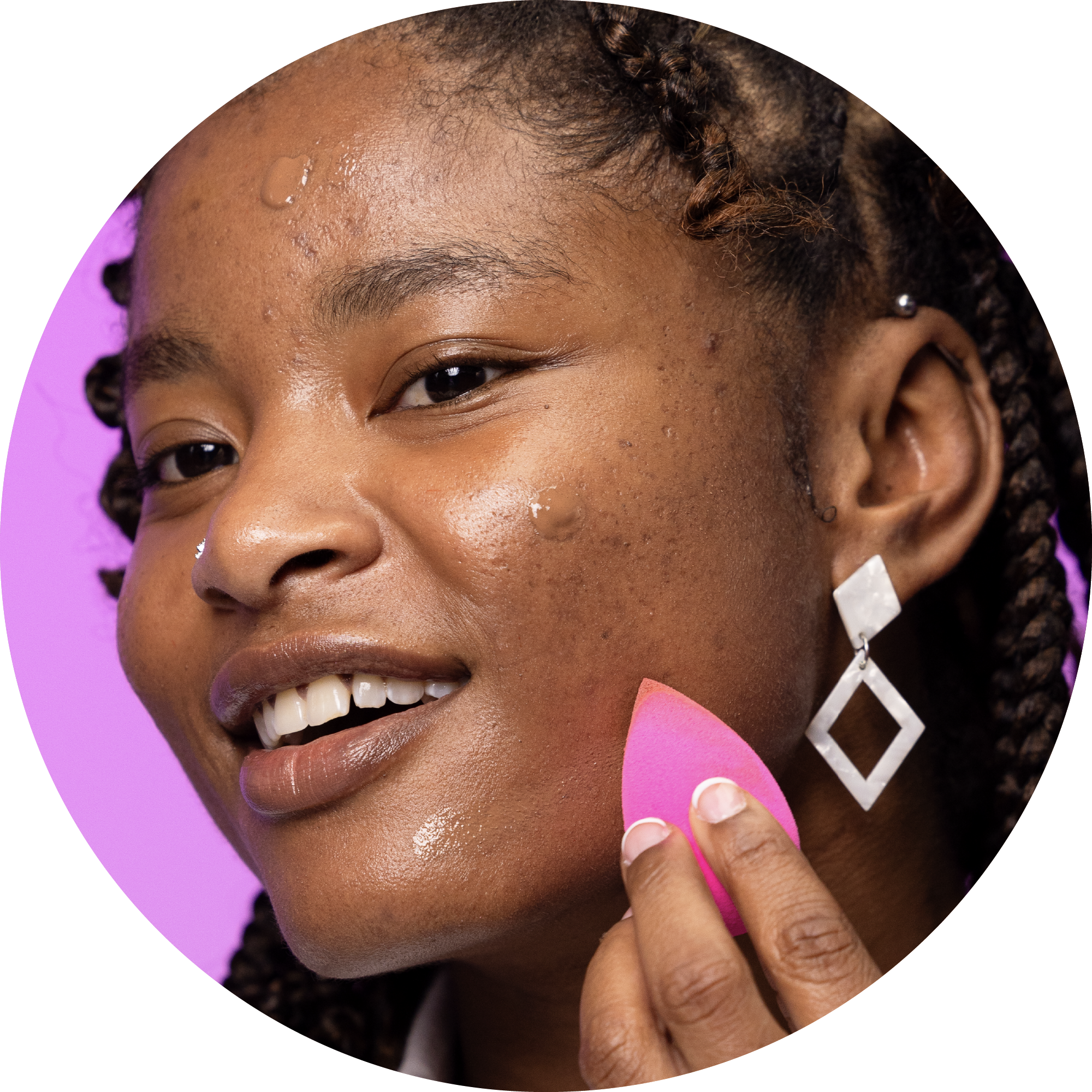 {"default":"a female model applying boldhue foundation to her face using a beautyblender sponge"}
