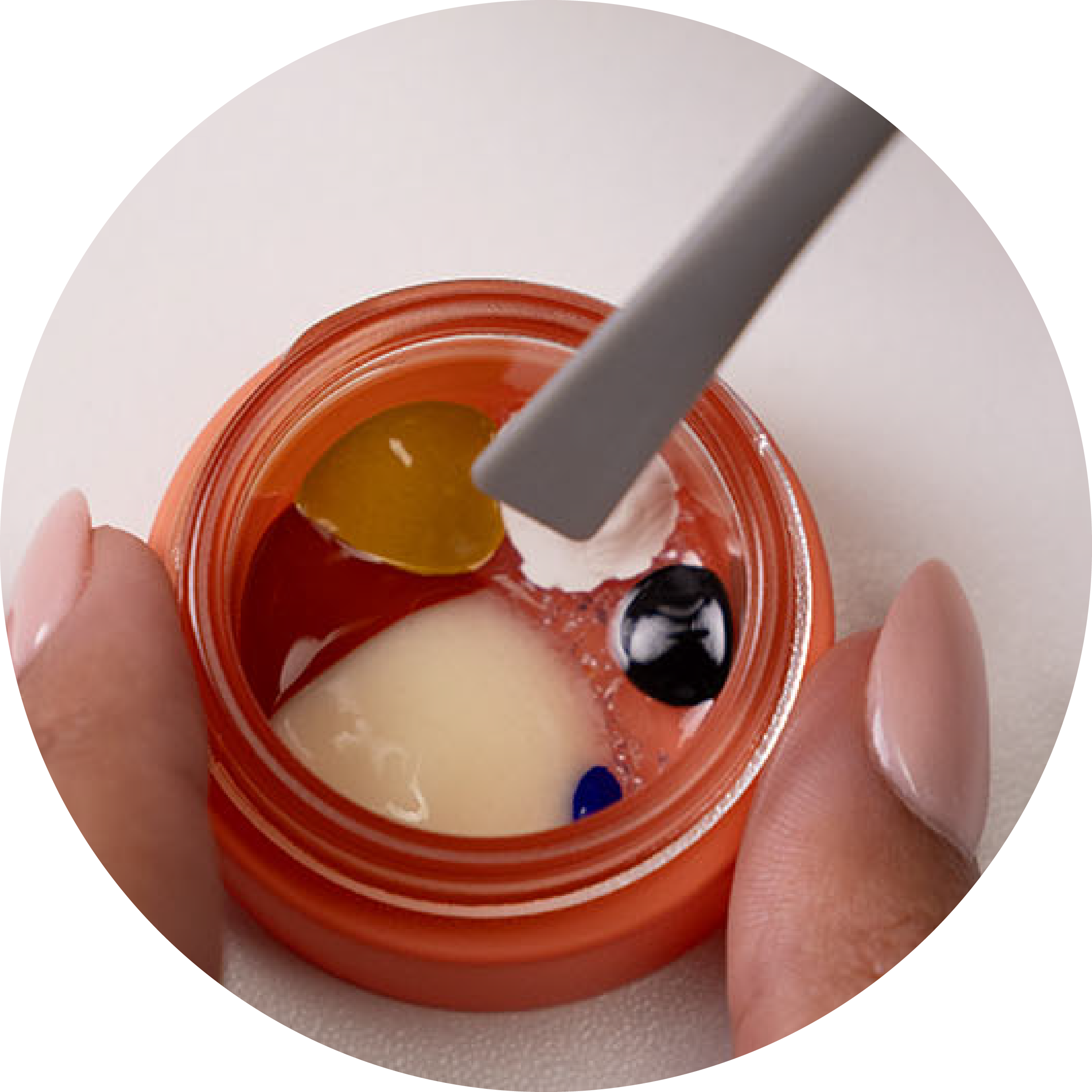 {"default":"a jar of unmixed boldhue foundation pigments in the colors of white, black, blue, yellow, red and the base foundation"}

