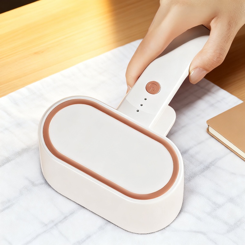 Haarklopfer & Haarballenentferner mit Saugfunktion, ergonomisch, Staubbox abnehmbar