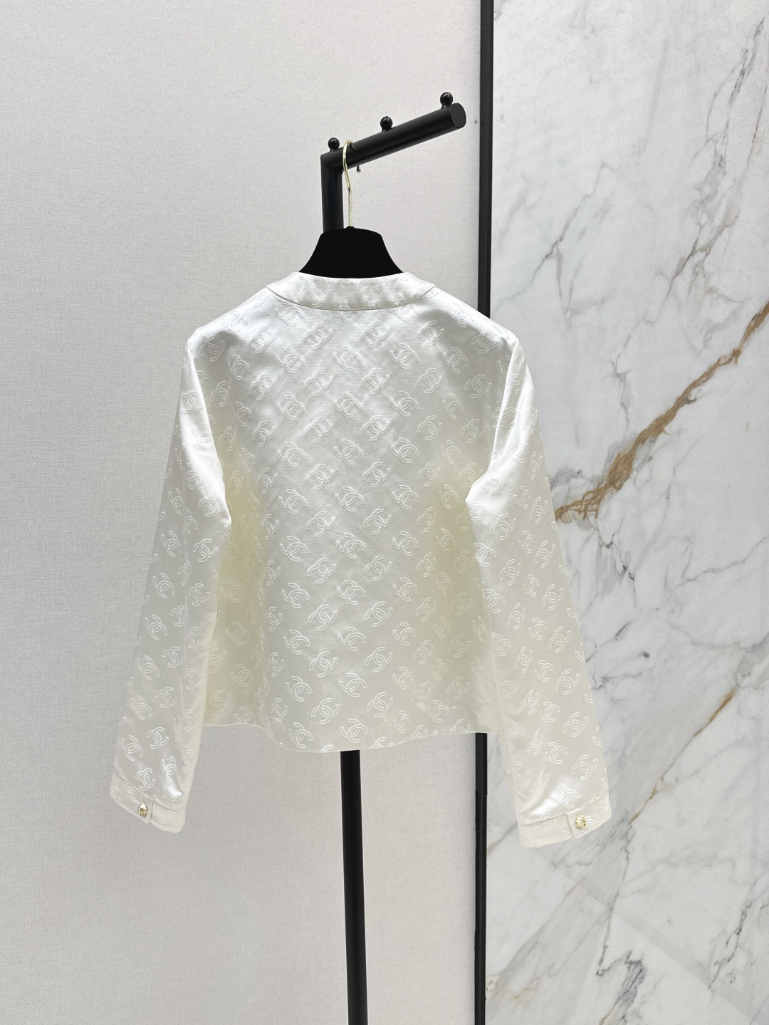 CC 25SS White embossed jacket with dark patterns