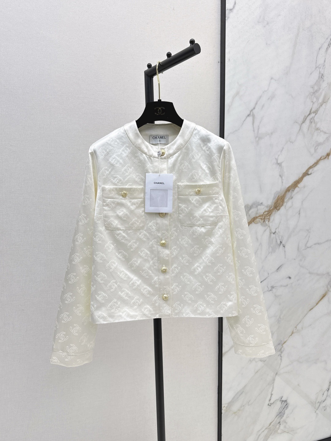 CC 25SS White embossed jacket with dark patterns