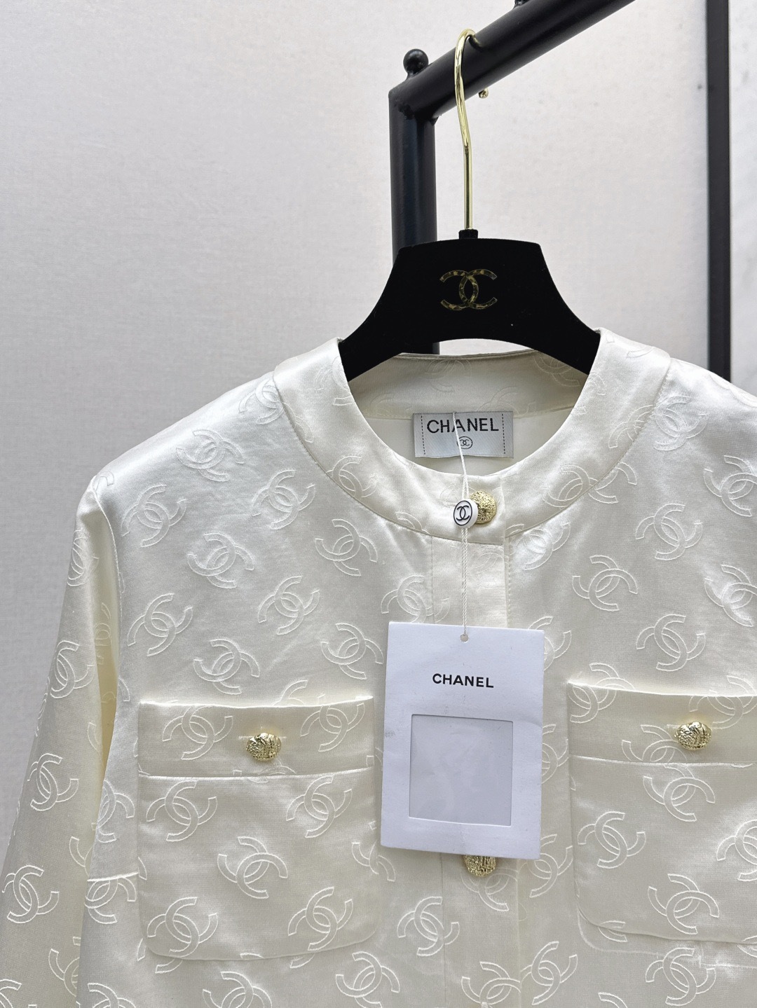 CC 25SS White embossed jacket with dark patterns