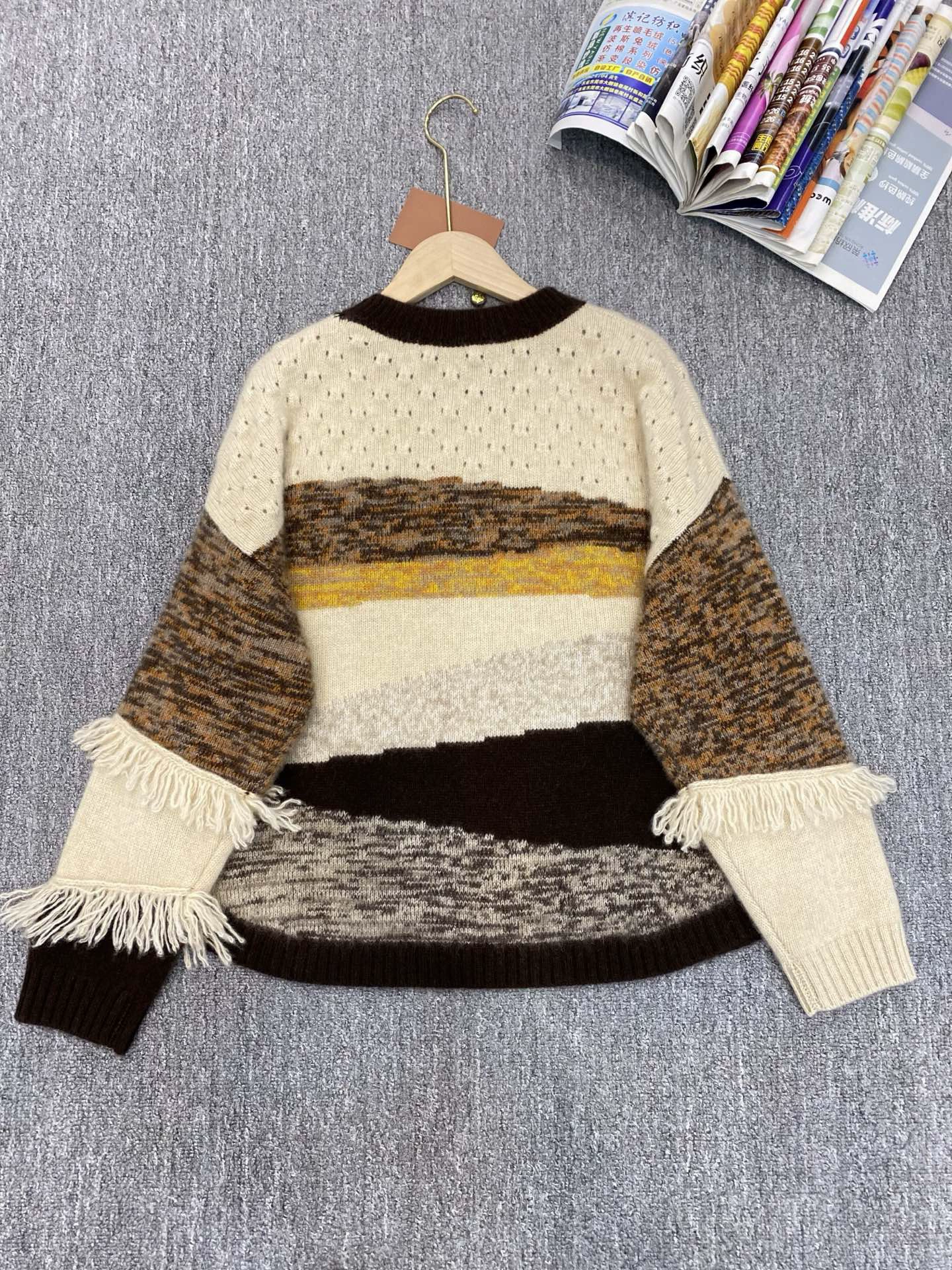 Women's Color Blocked Striped Thickened Sweater with Tassel Detail Round Neck Loose Knitted Pullover Sweater