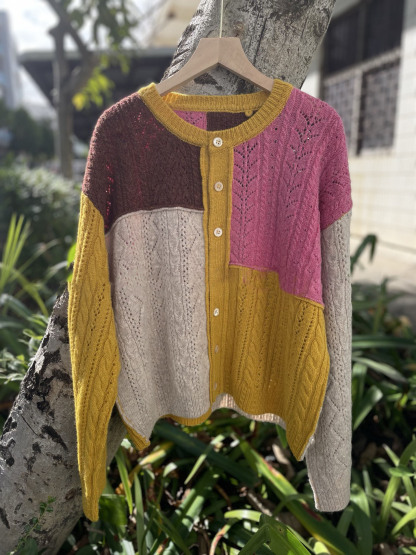 Irregularly pieced together crew neck wool knit cardigan