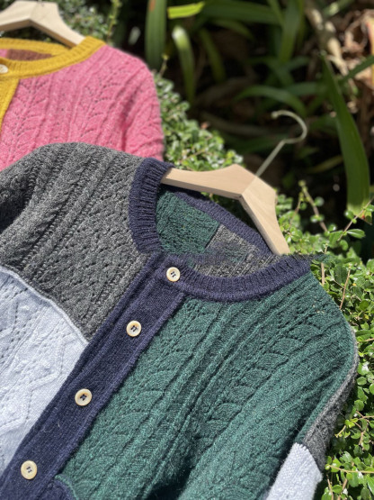 Irregularly pieced together crew neck wool knit cardigan