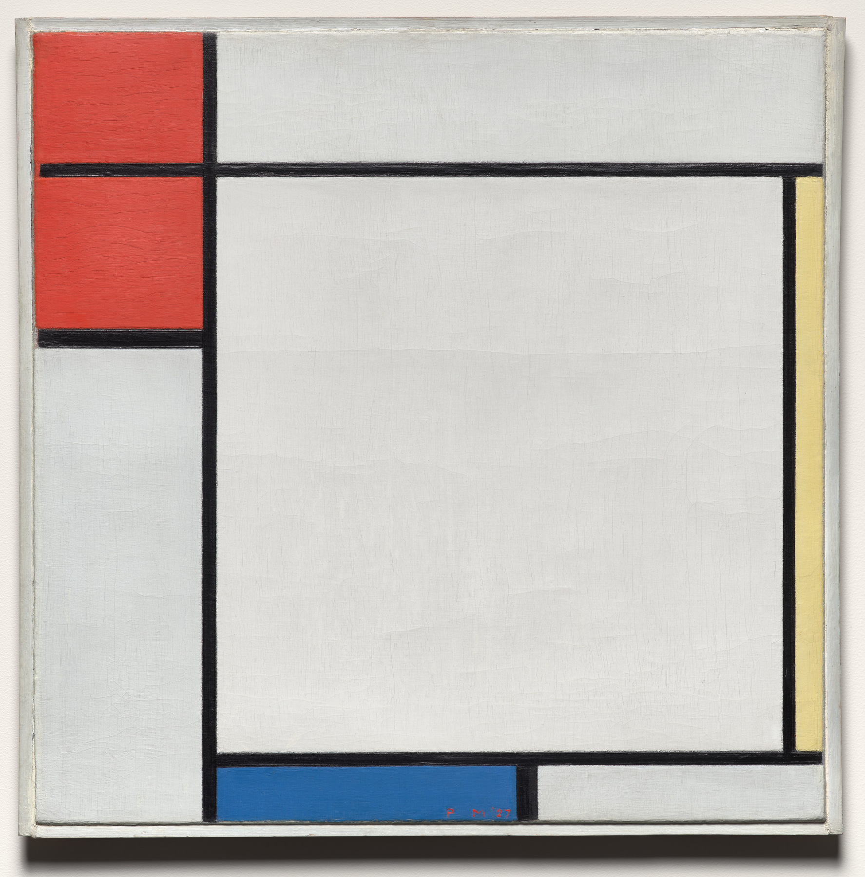 Mondrian’s painting has red blocks at upper left, a thin yellow strip at right and a blue band along the bottom, separated by black lines and large pale rectangles.