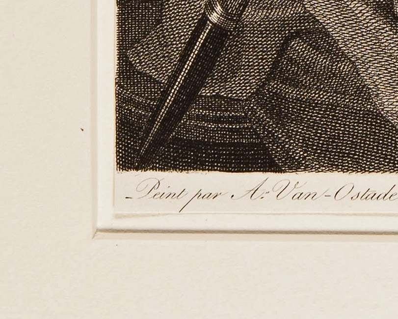 A close view shows the exposed edge of the engraving inside the surrounding mat opening.