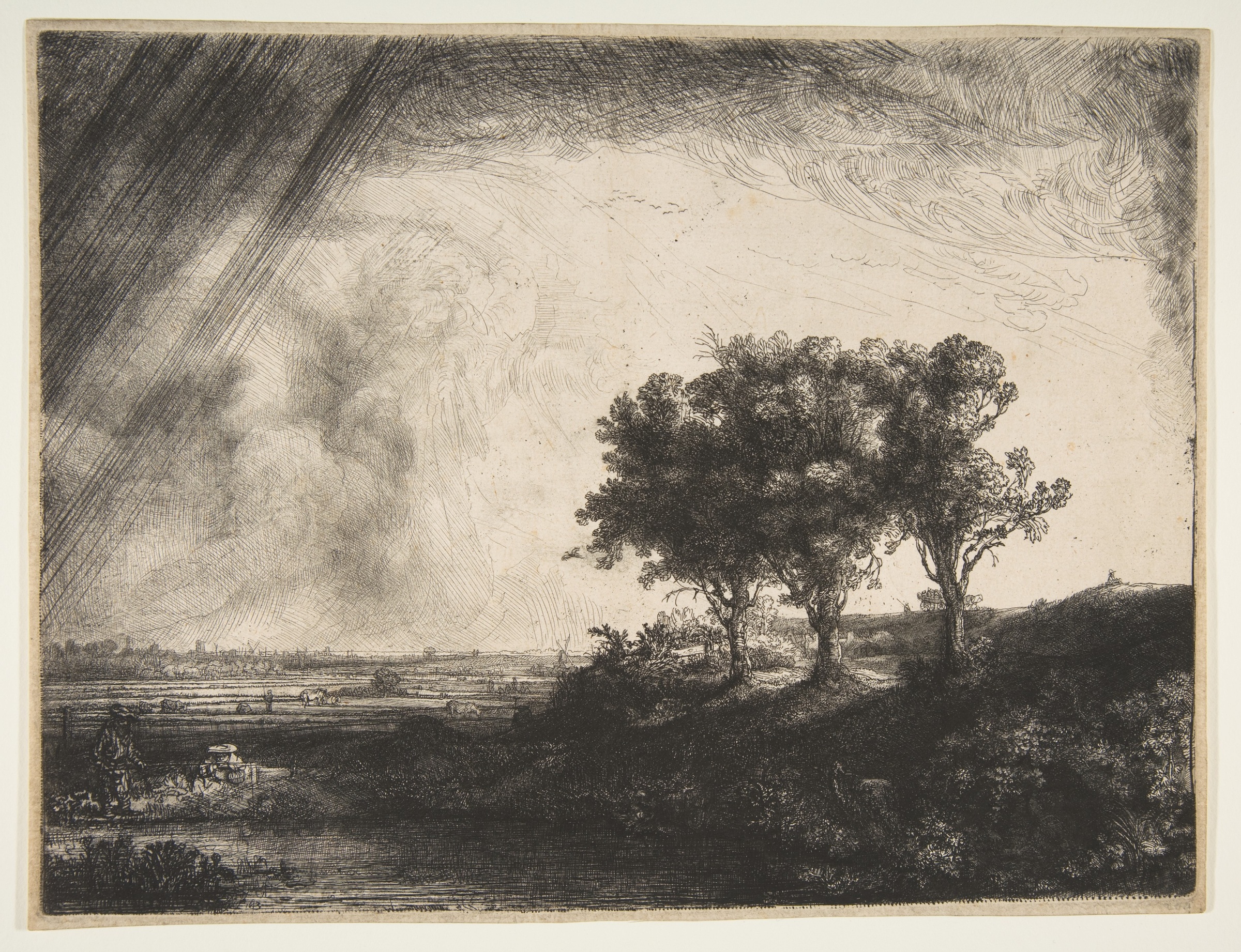 Three trees rise on a bank at right beneath dark diagonal storm marks, with tiny figures in an open landscape.