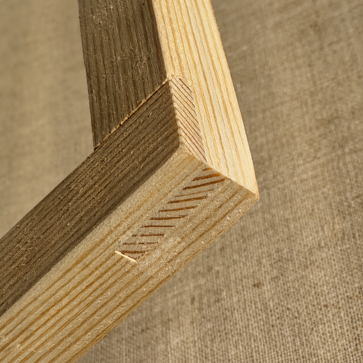 Whispart series artwork — close-up of the solid wood stretcher and woven canvas used to give physical form to the work