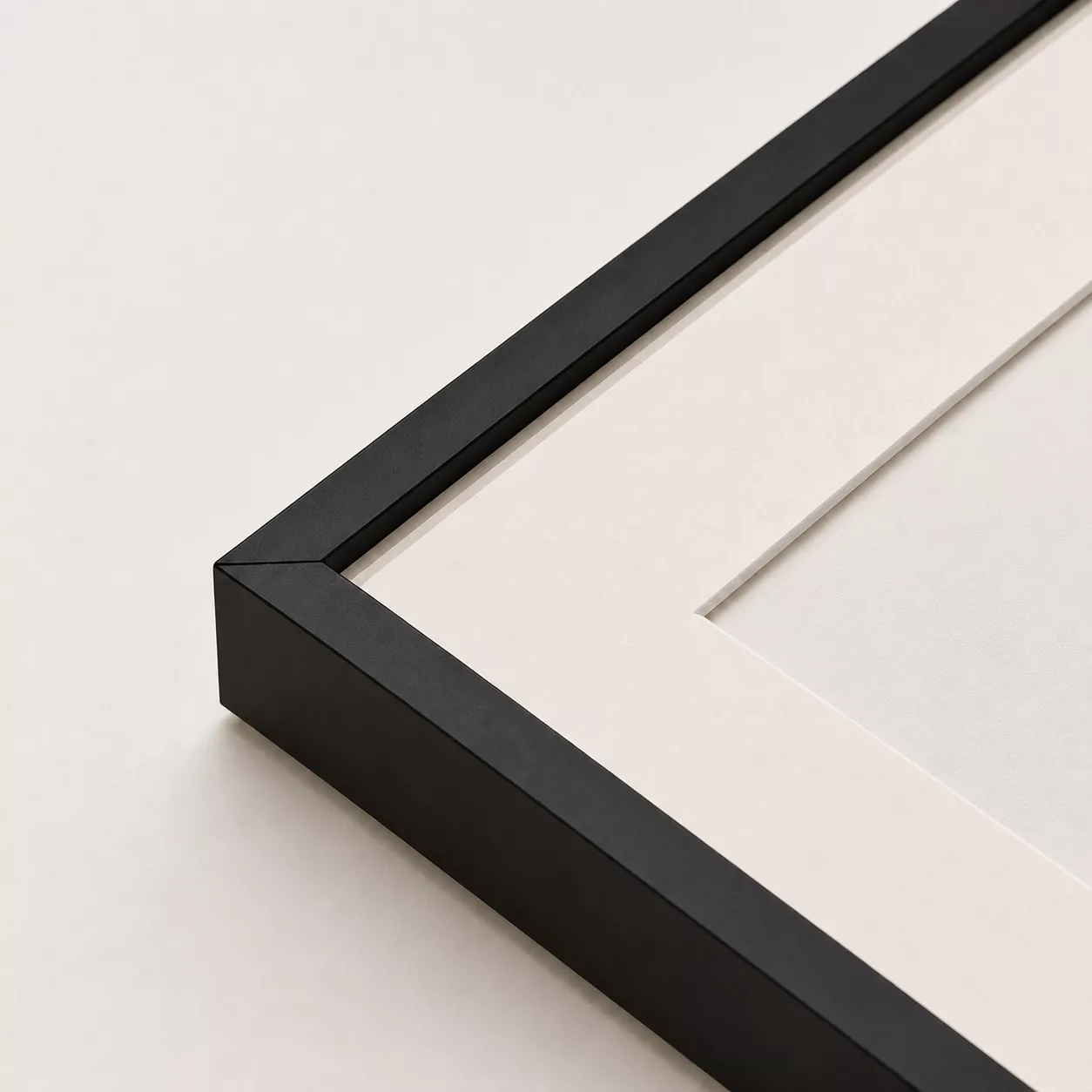 Black precision-cut aluminum frame with mat and acrylic glazing