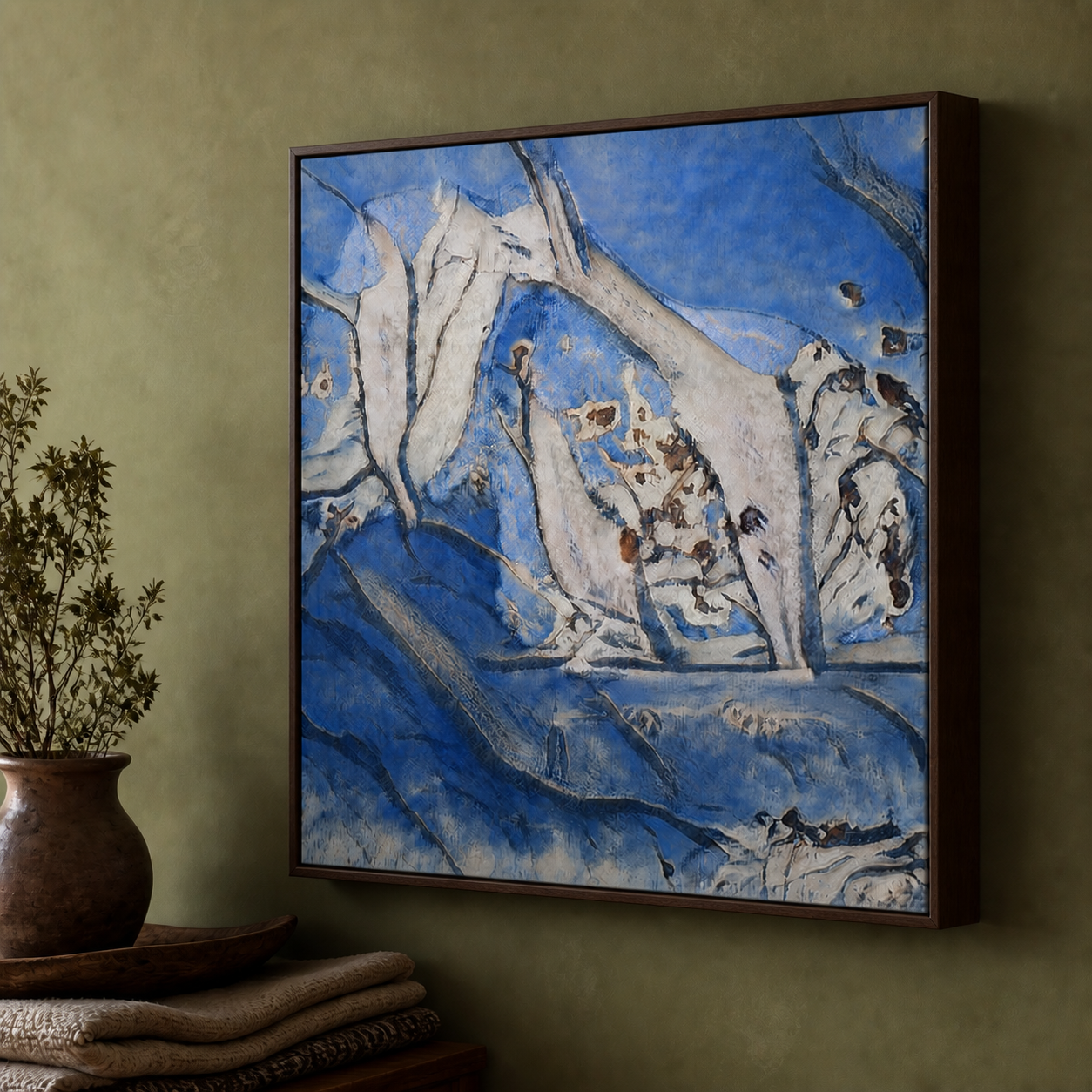 WhispArt Tide Without a Name, blue and pale flowing forms in a frame on an olive wall; supplied room illustration.