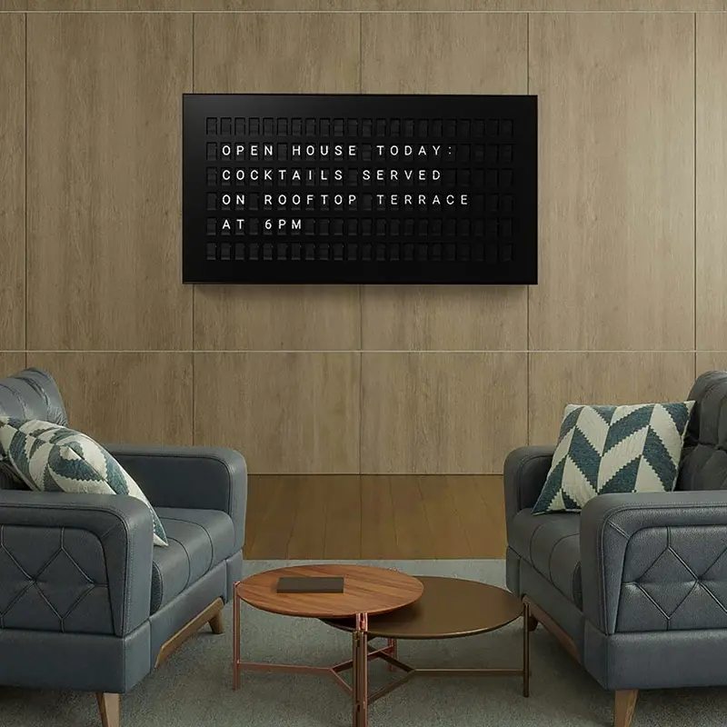 Smart message display showing an open house announcement in a welcoming lounge