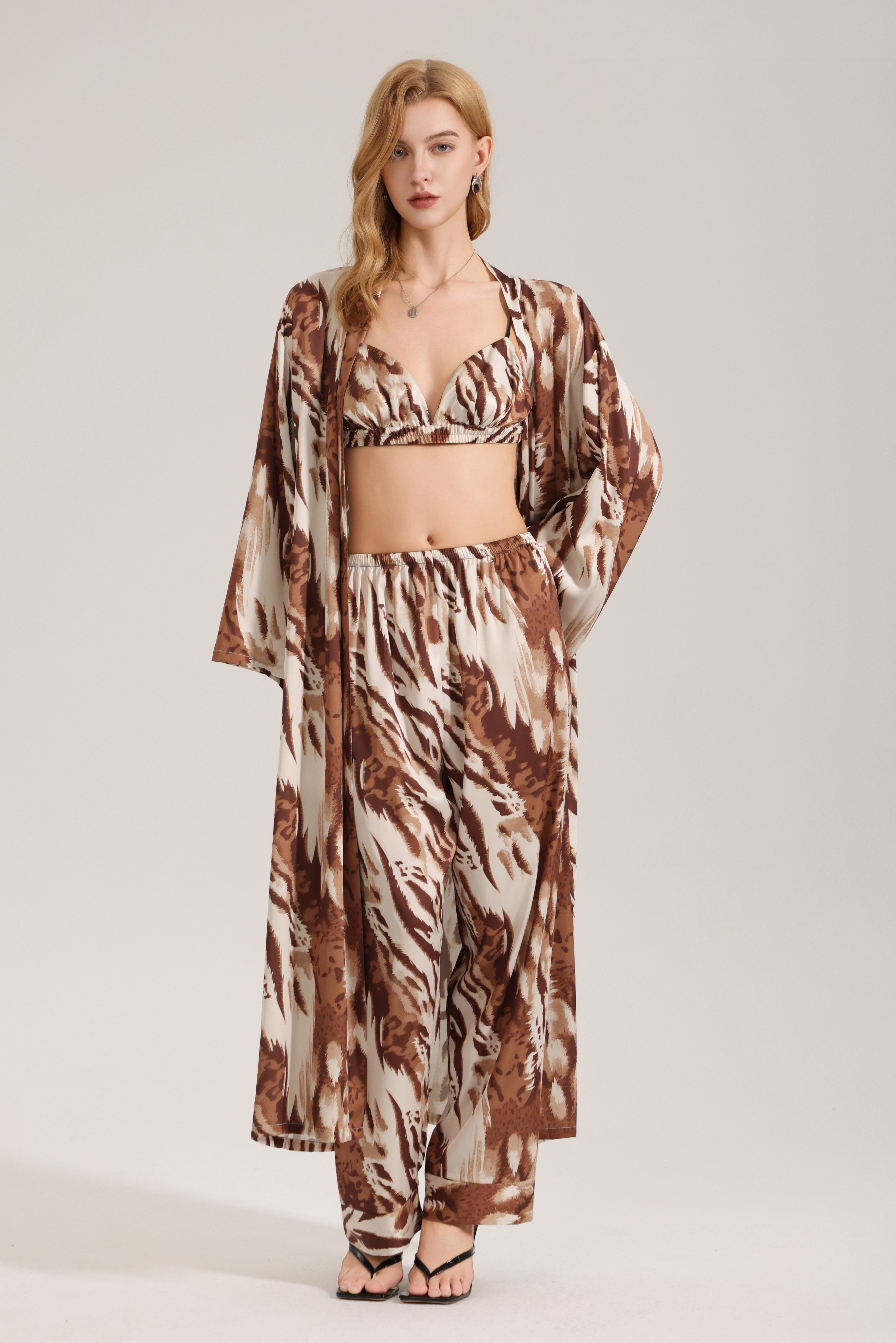 Golden brown leopard print satin pajamas for women, long autumn style, single robe, wild and luxurious home wear.