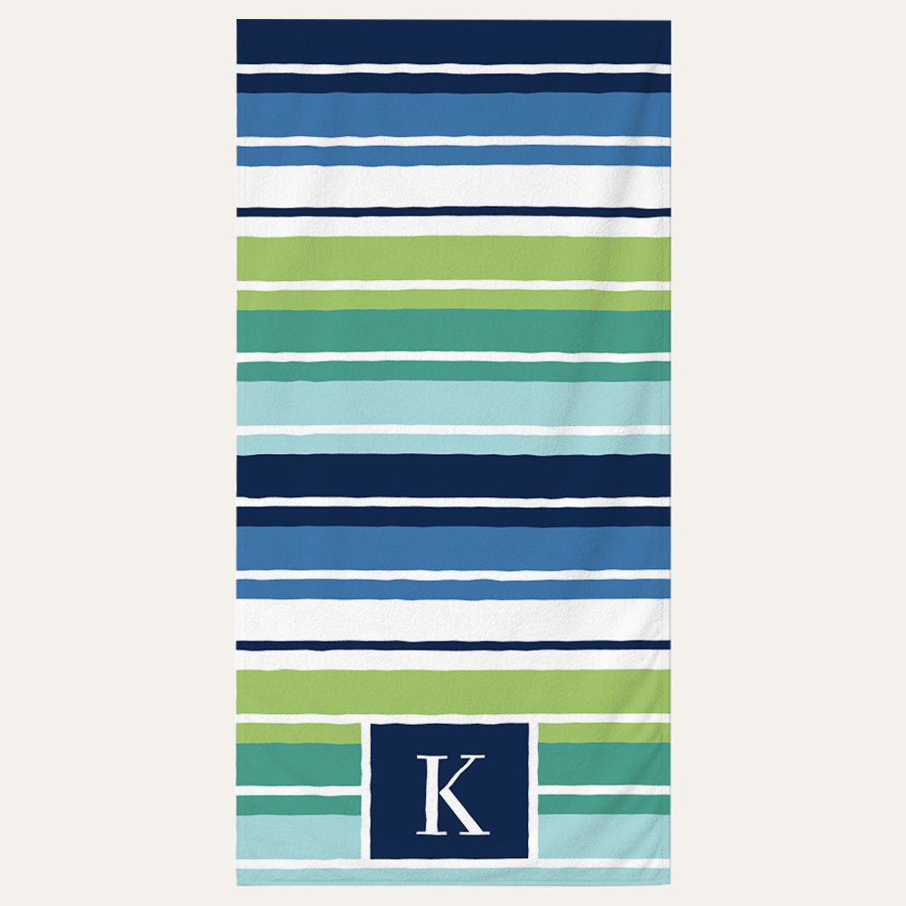 Personalized striped beach towel with custom monogram letter design for beach and pool use